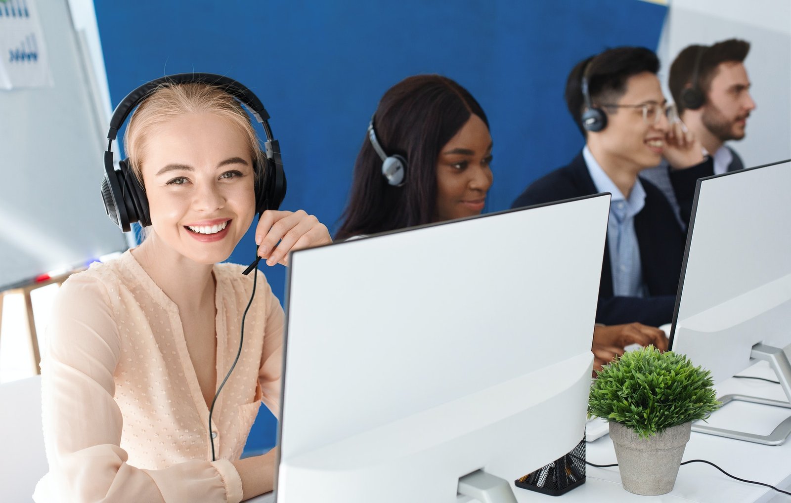 joyful-customer-service-agents-with-headphones-communicating-with-clients-at-call-center.jpg joyful-customer-service-agents-with-headphones-communicating-with-clients-at-call-center.jpg